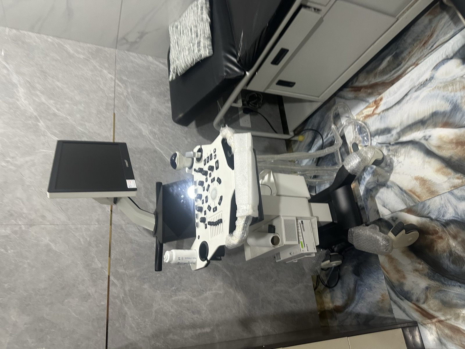 Medical equipment at Klinik Muhibbah — ophthalmology machines, marble floors