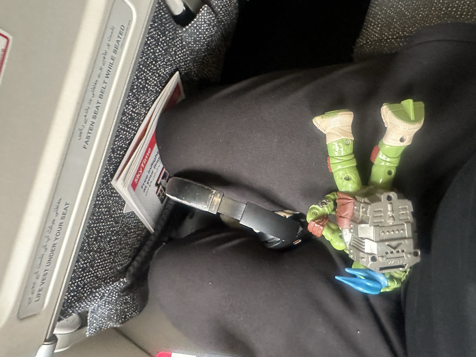 Toy soldier on the airplane seat tray