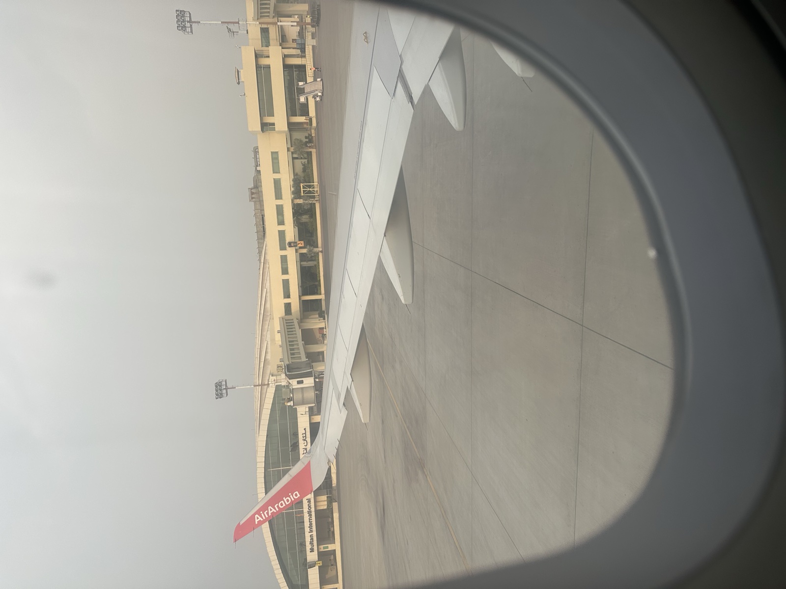 Multan International Airport window — runway and sky