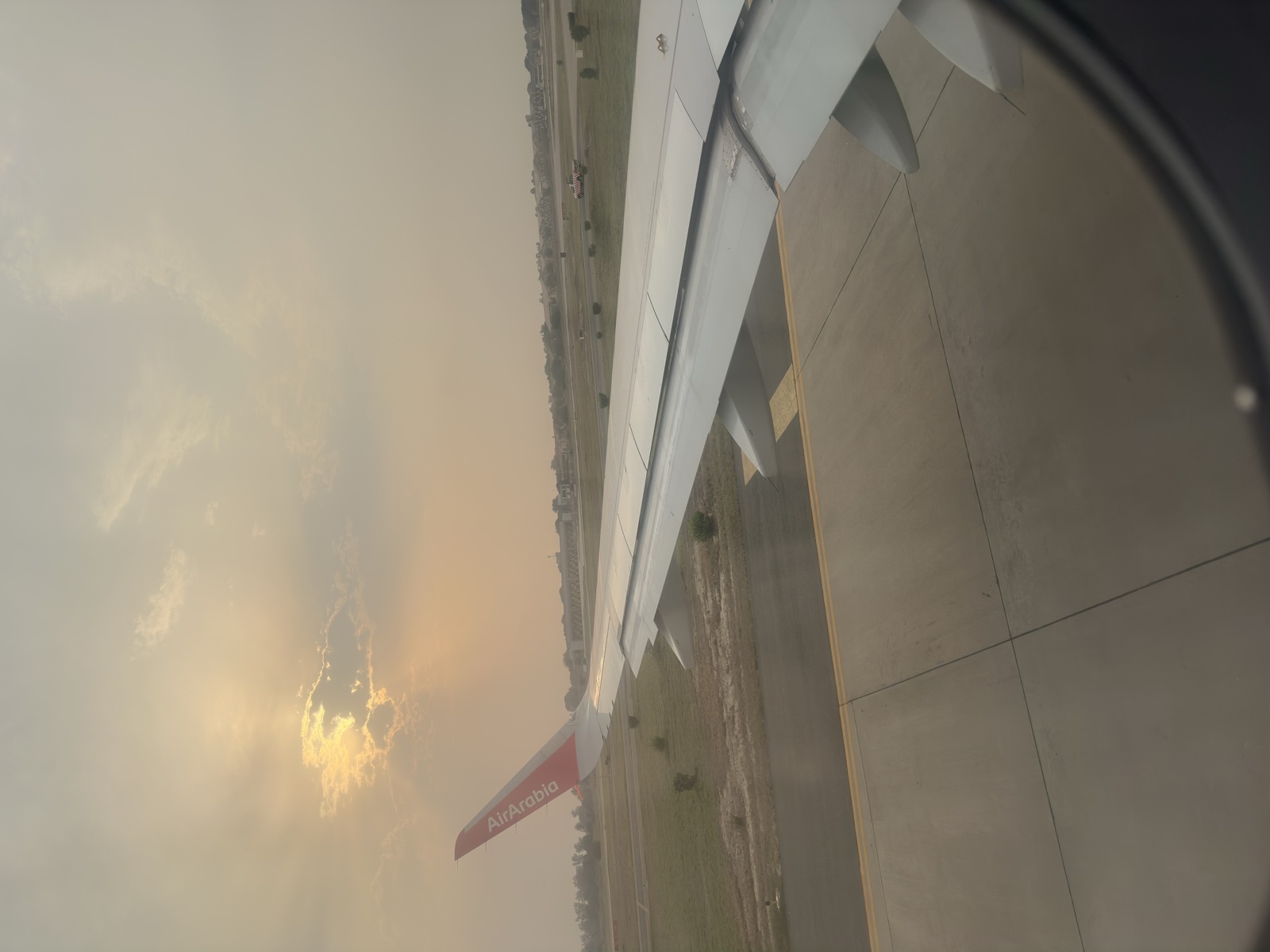 Golden sky from the plane window — returning to Malaysia