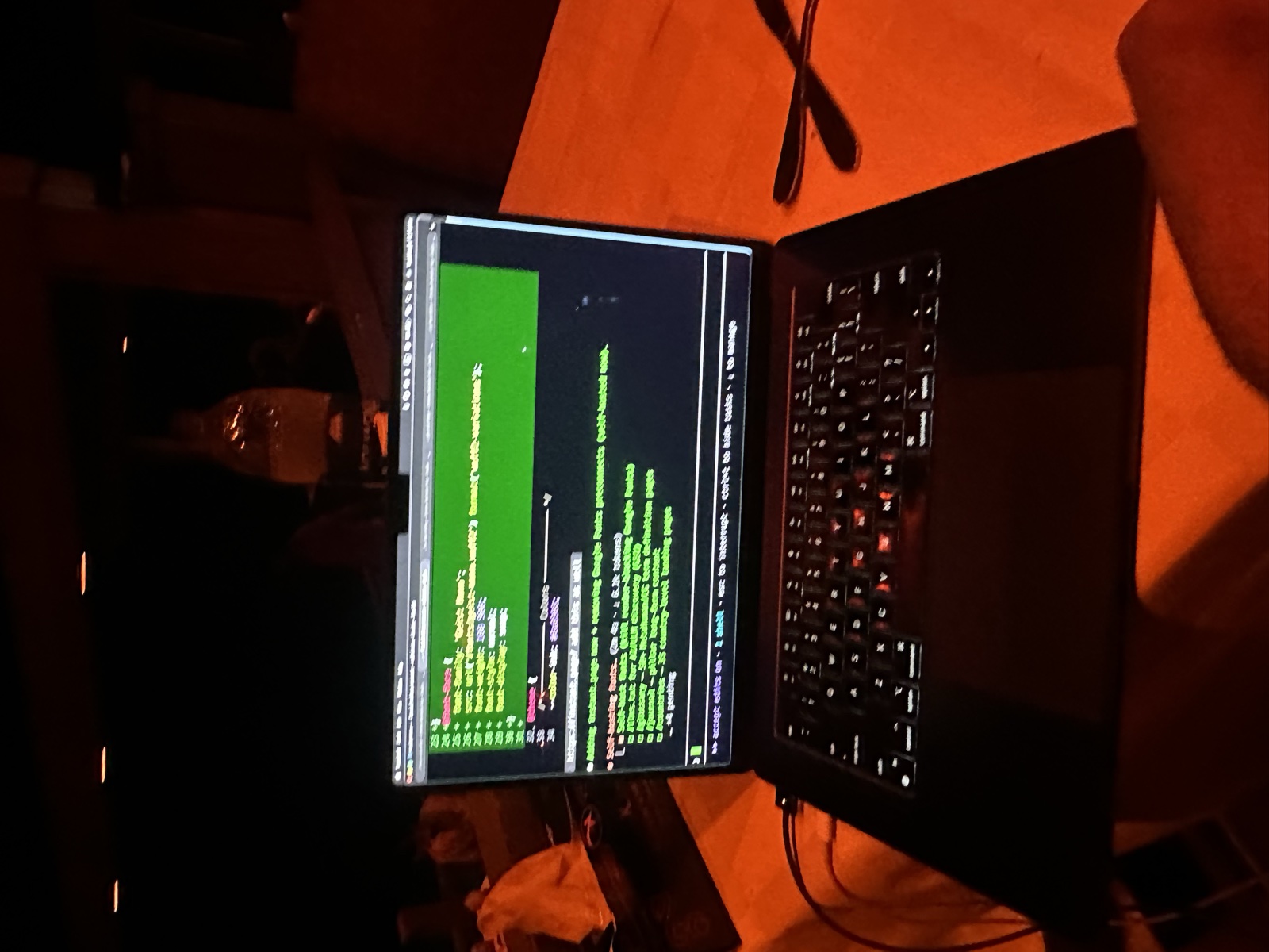 Late night coding session — MacBook in a dark room