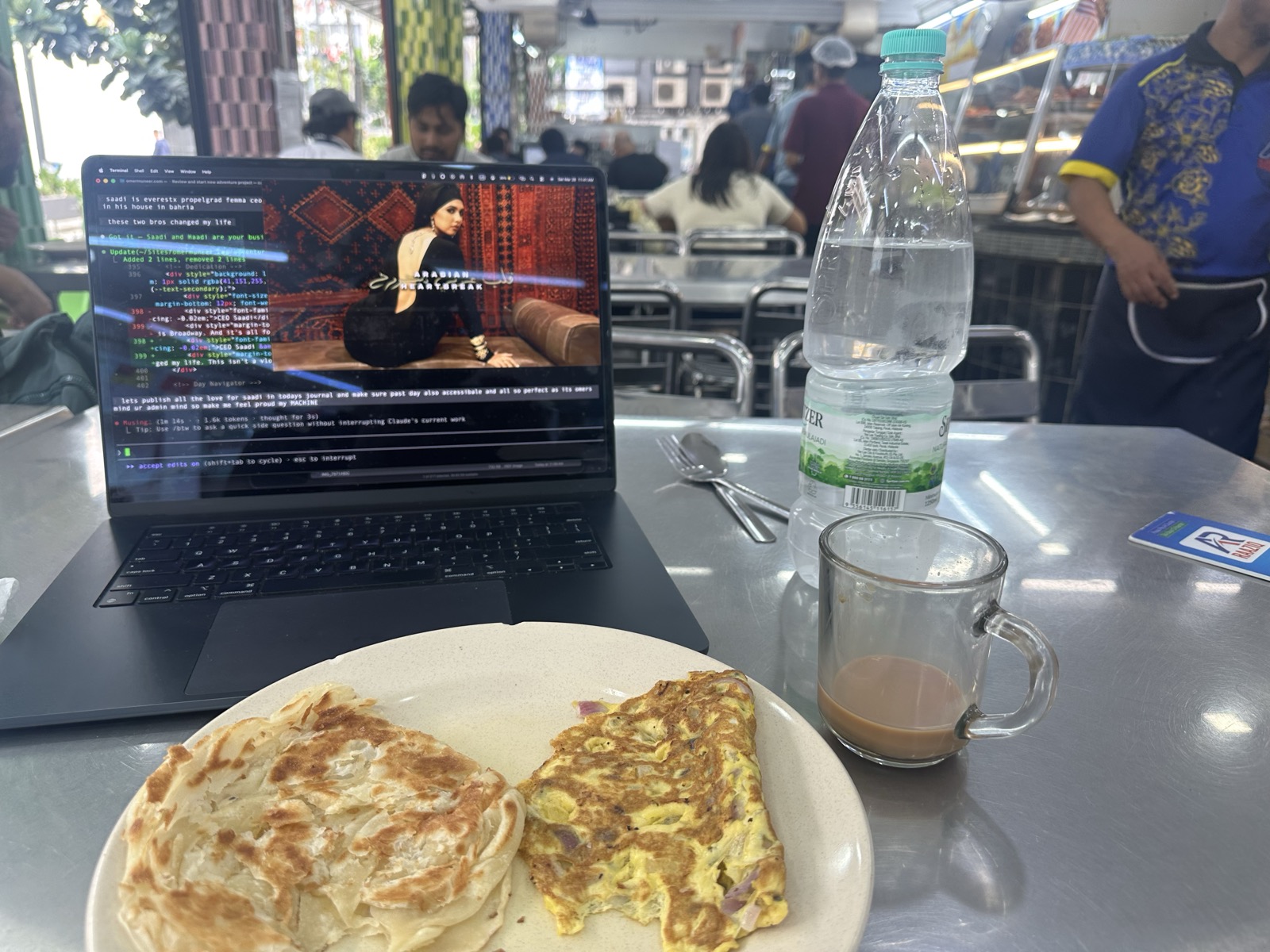 Workspace at Ar-Raziq with roti canai and teh tarik