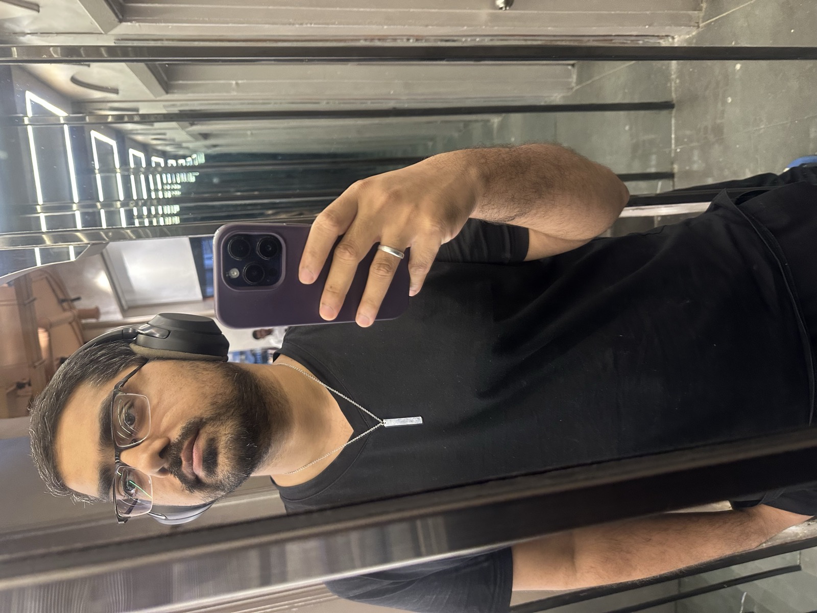 Omer Muneer Qazi — elevator mirror selfie, DHA Karachi, 3:05 AM, May 10, 2026
