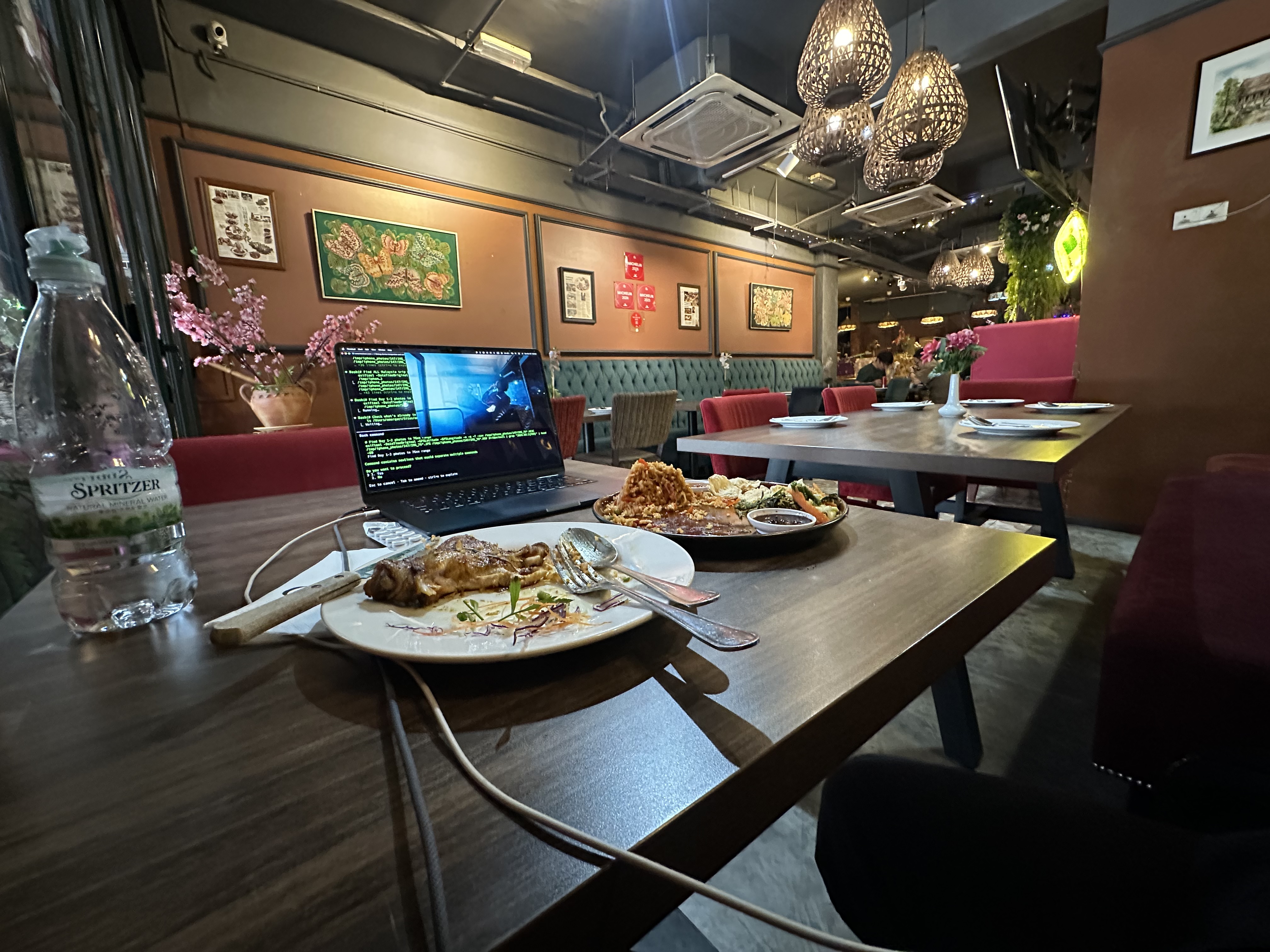 Congkak restaurant — MacBook, nasi goreng, wicker chandeliers, green banquettes, Day 3 workspace