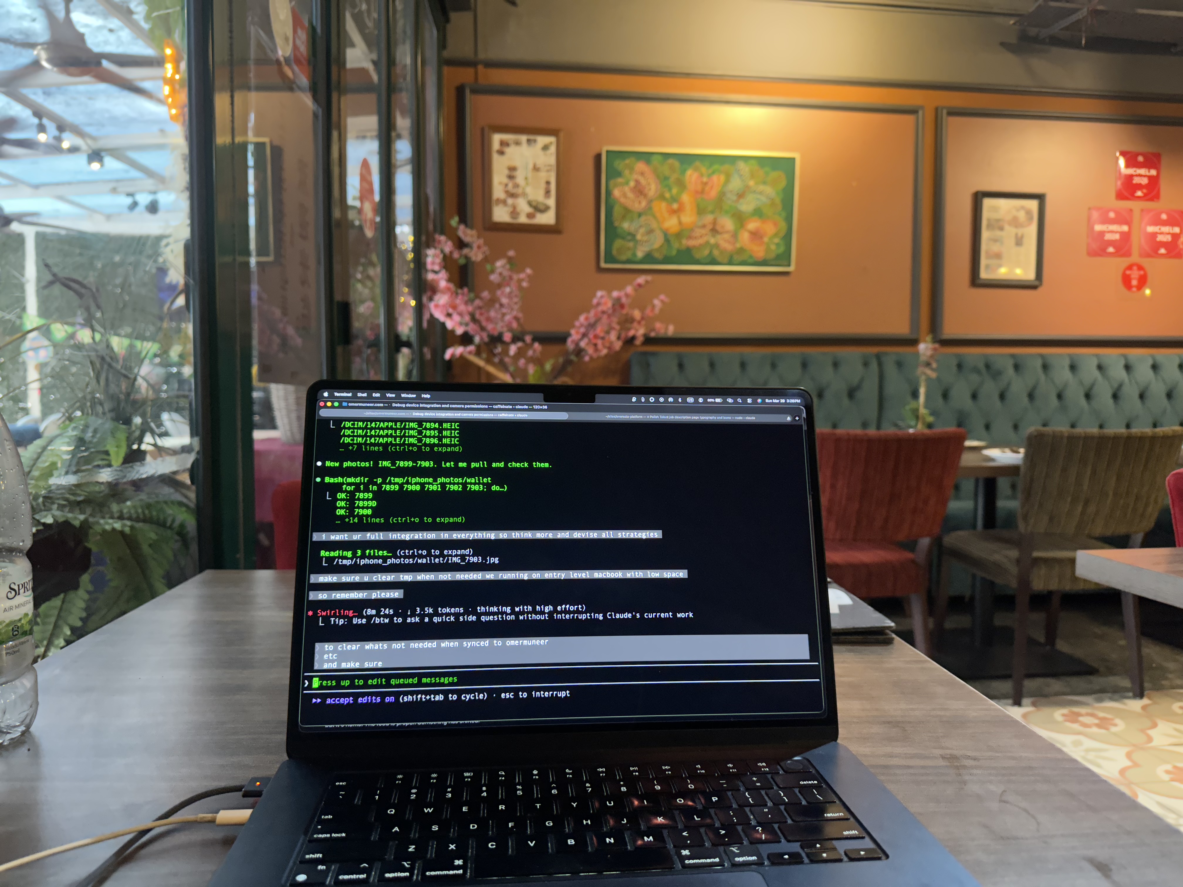 MacBook with Claude terminal running at Congkak restaurant