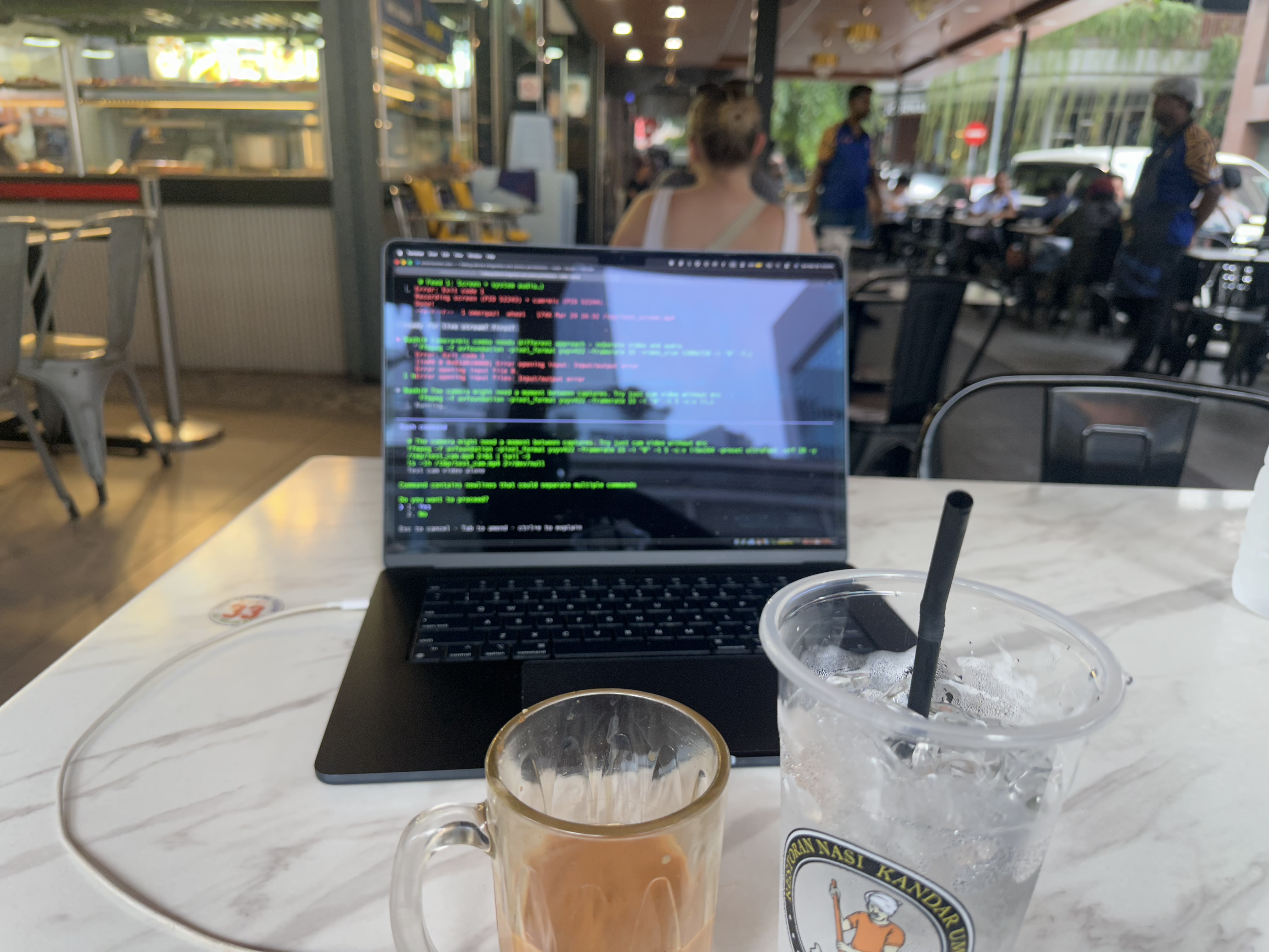 MacBook terminal with teh tarik and ice water at Nasi Kandar