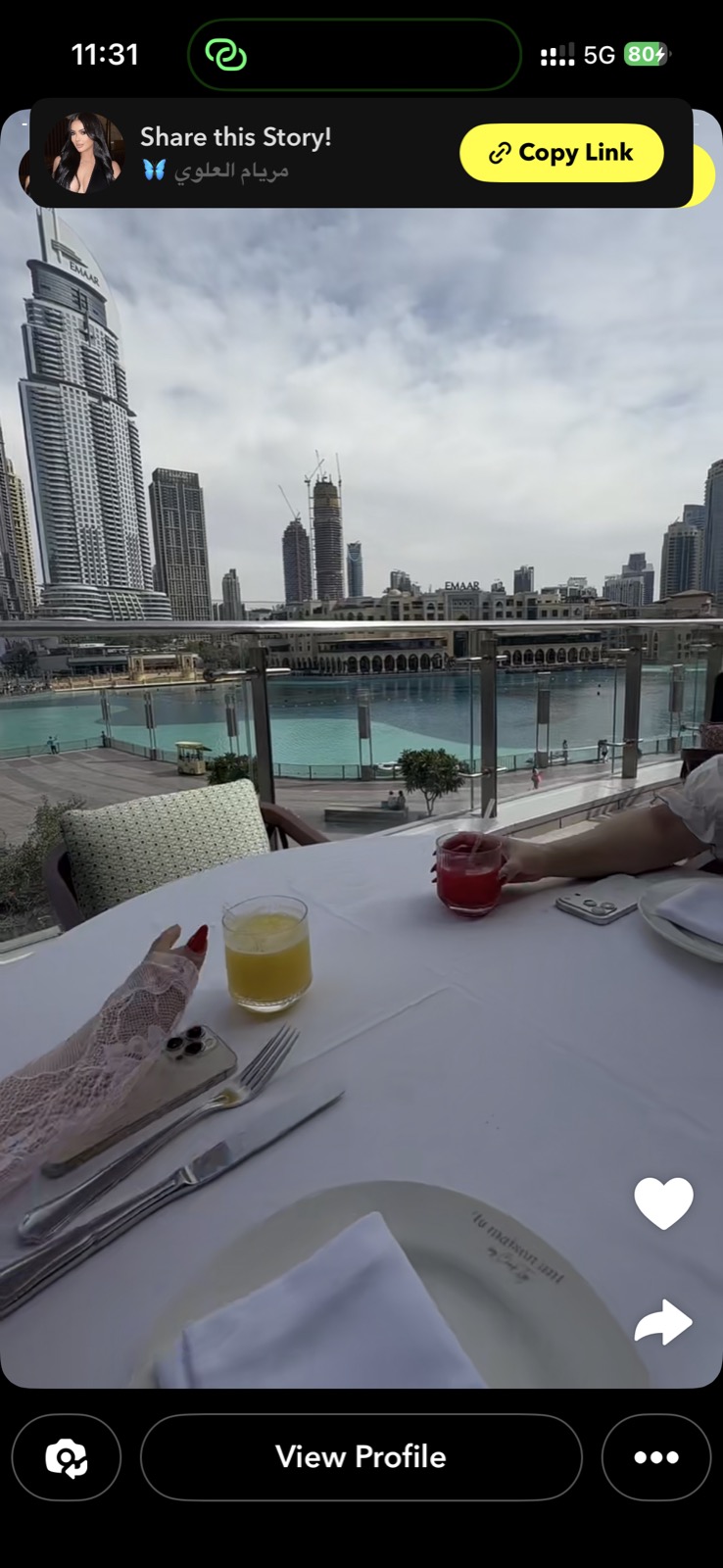 Maryam Alawi Dubai Snapchat — La Maison restaurant, Burj Khalifa behind, juice, EMAAR buildings