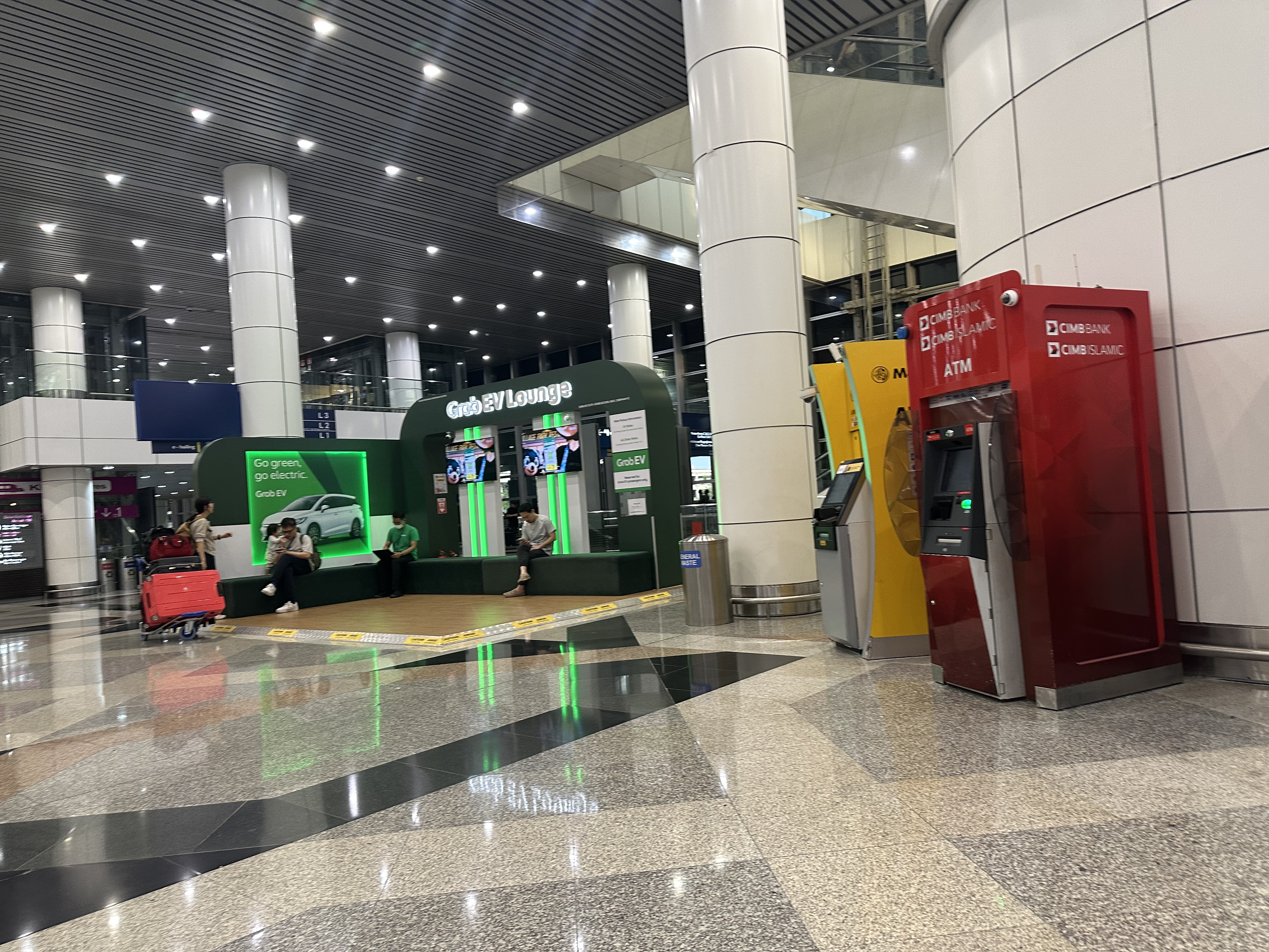 KLIA2 arrivals hall — another angle, spotlights on ceiling