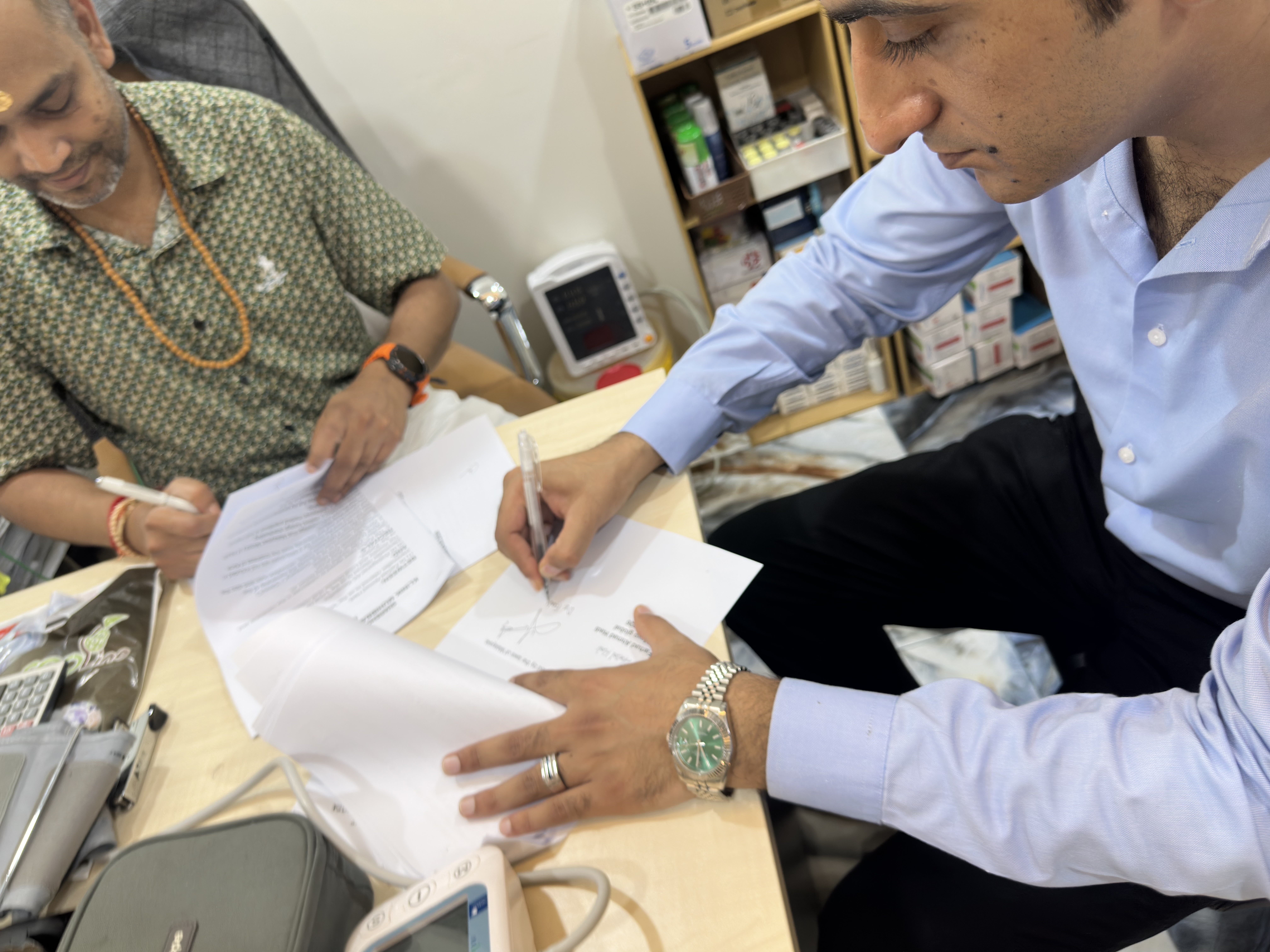 Close-up of pen on paper — the signing moment