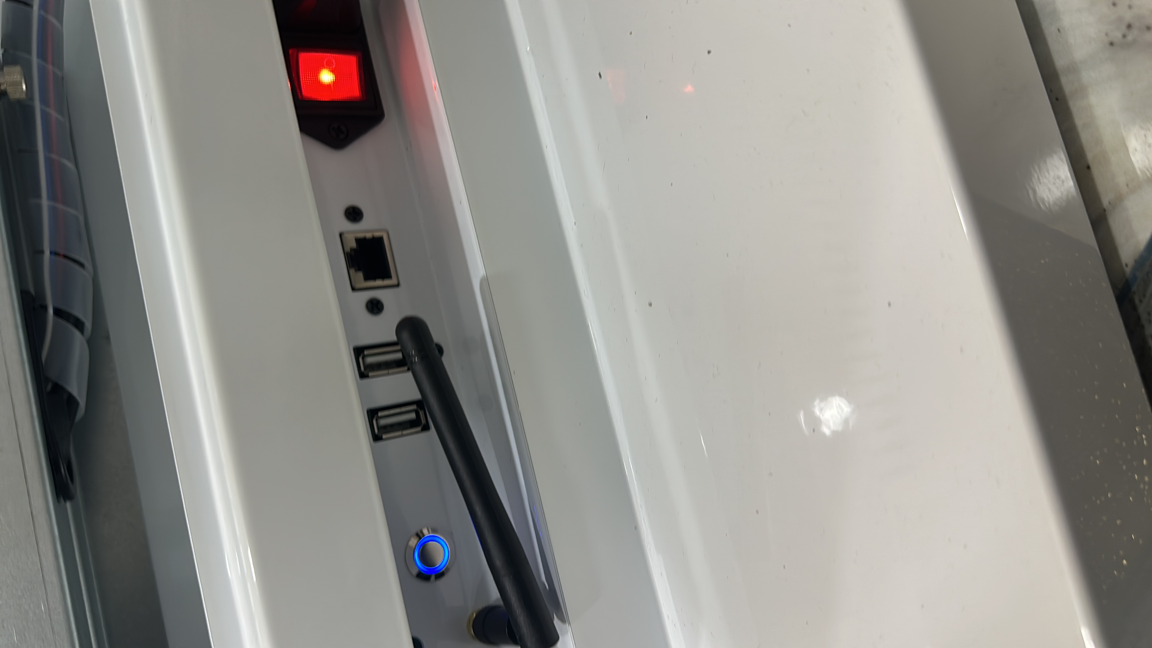 Kiosk I/O panel — Ethernet, USB, WiFi antenna, power
