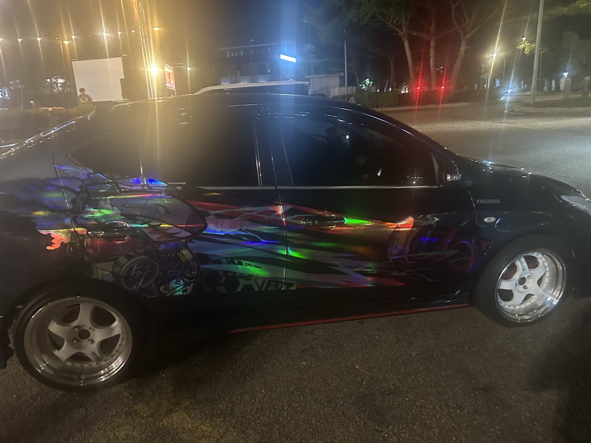 Holographic wrapped car in JB at night