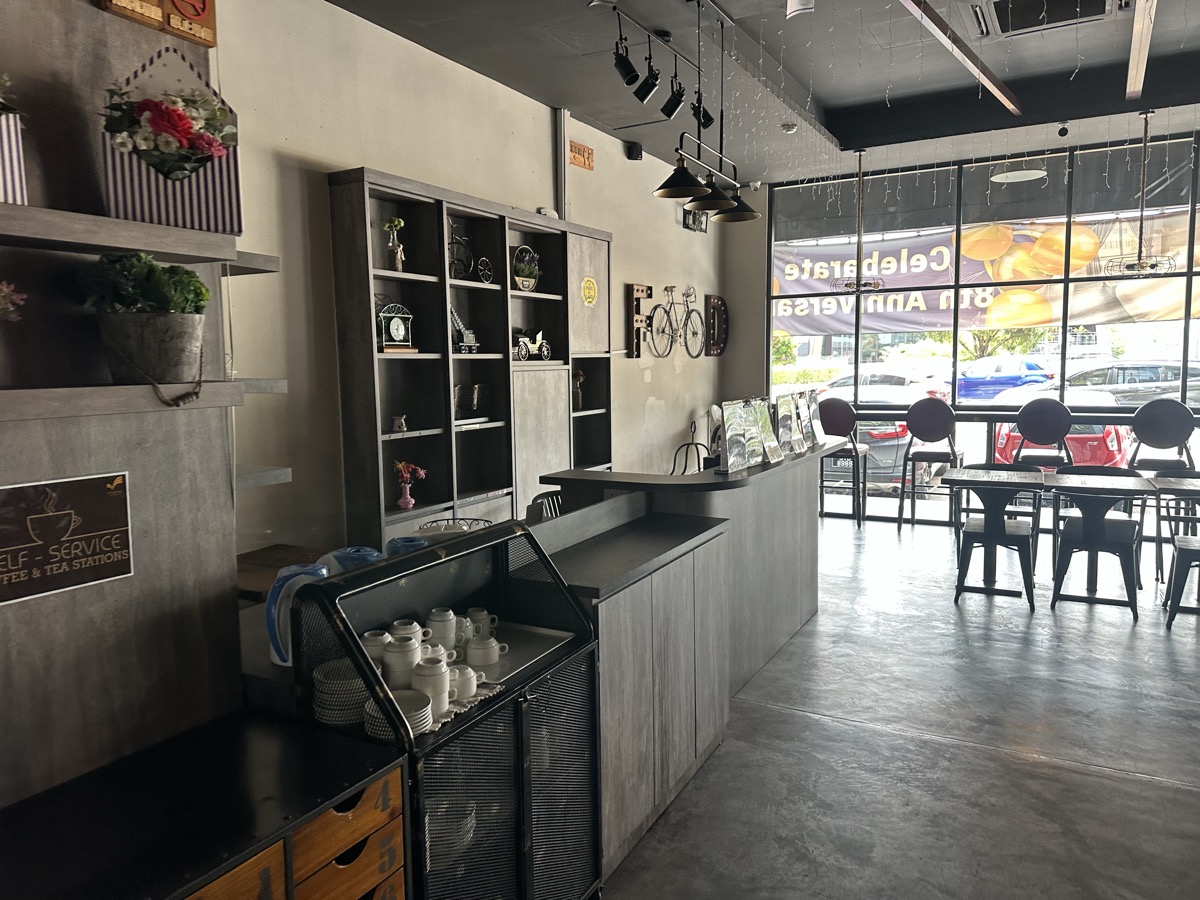 Industrial cafe interior — coffee bar, concrete walls