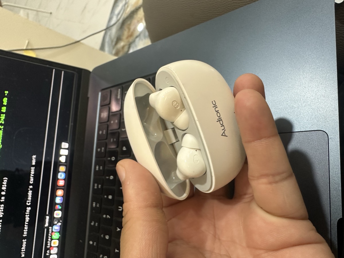 Haadi's Audionic wireless earbuds left on MacBook at Klinik Muhibbah