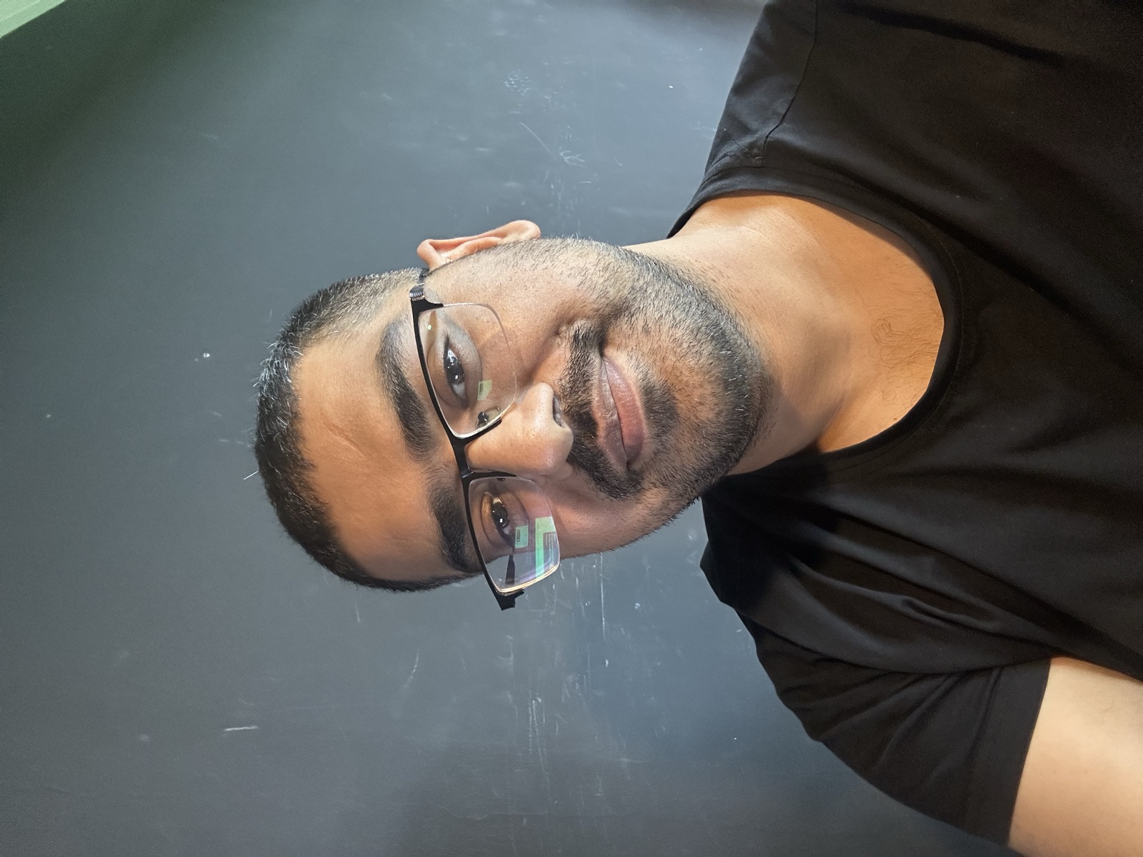 Omer selfie, slight angle difference, same black shirt, same focus