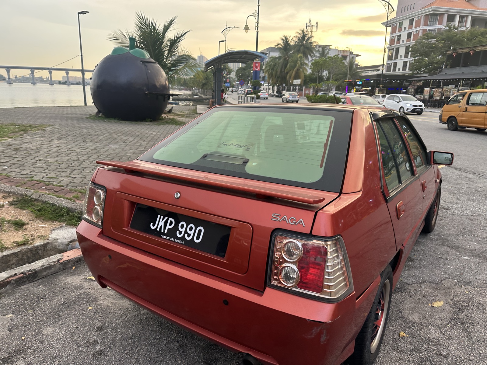 Red Proton Saga, JKP 990 — JB waterfront at dusk