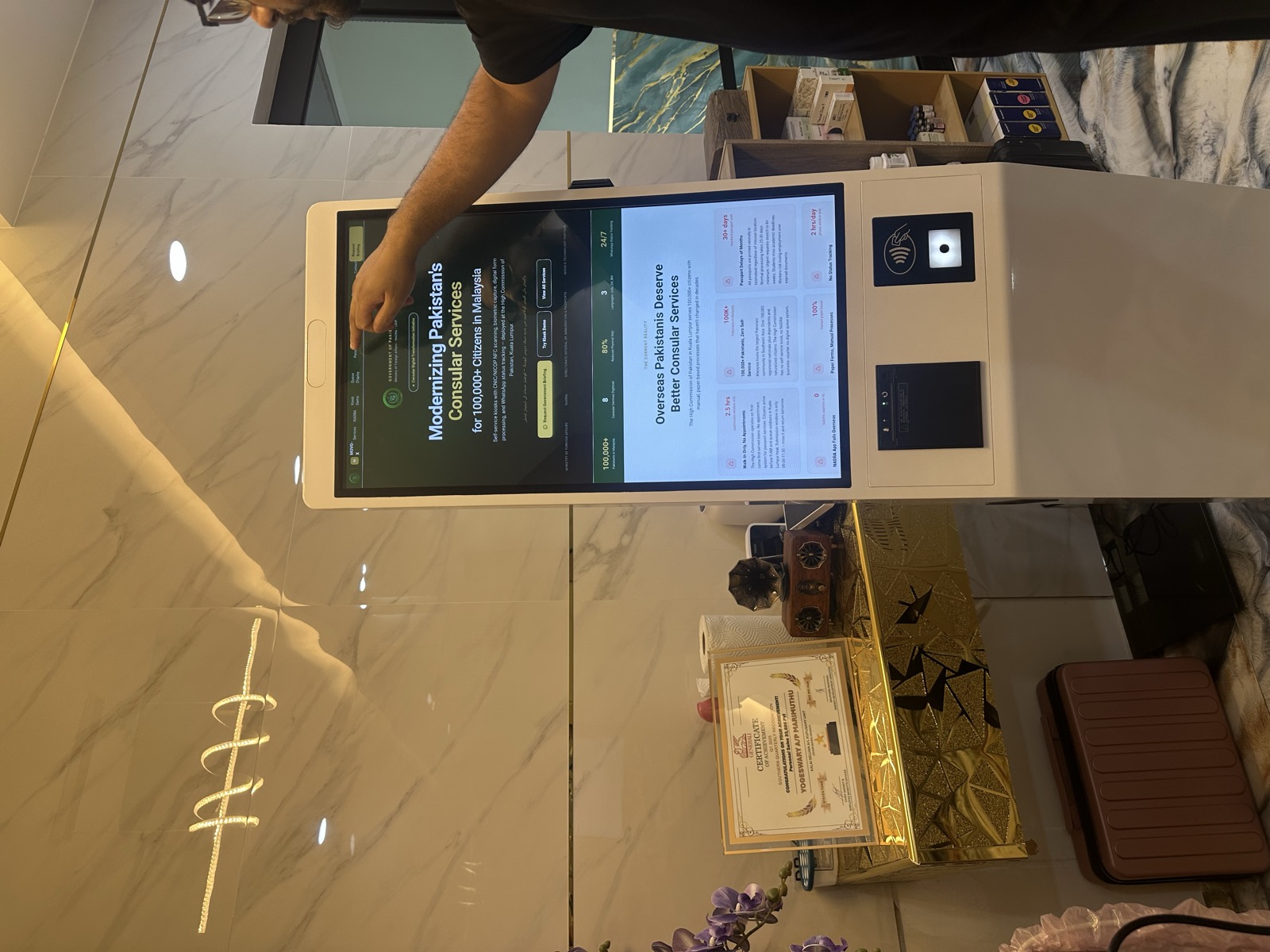 MoVO-X kiosk live at Pakistan Consulate KL — marble lobby