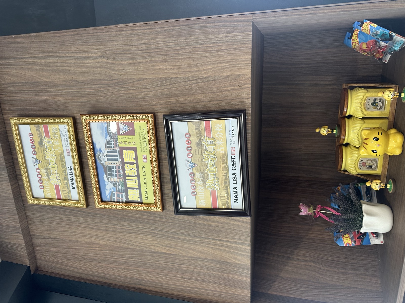 Mama Lisa — collectibles shelf with SpongeBob and Godzilla