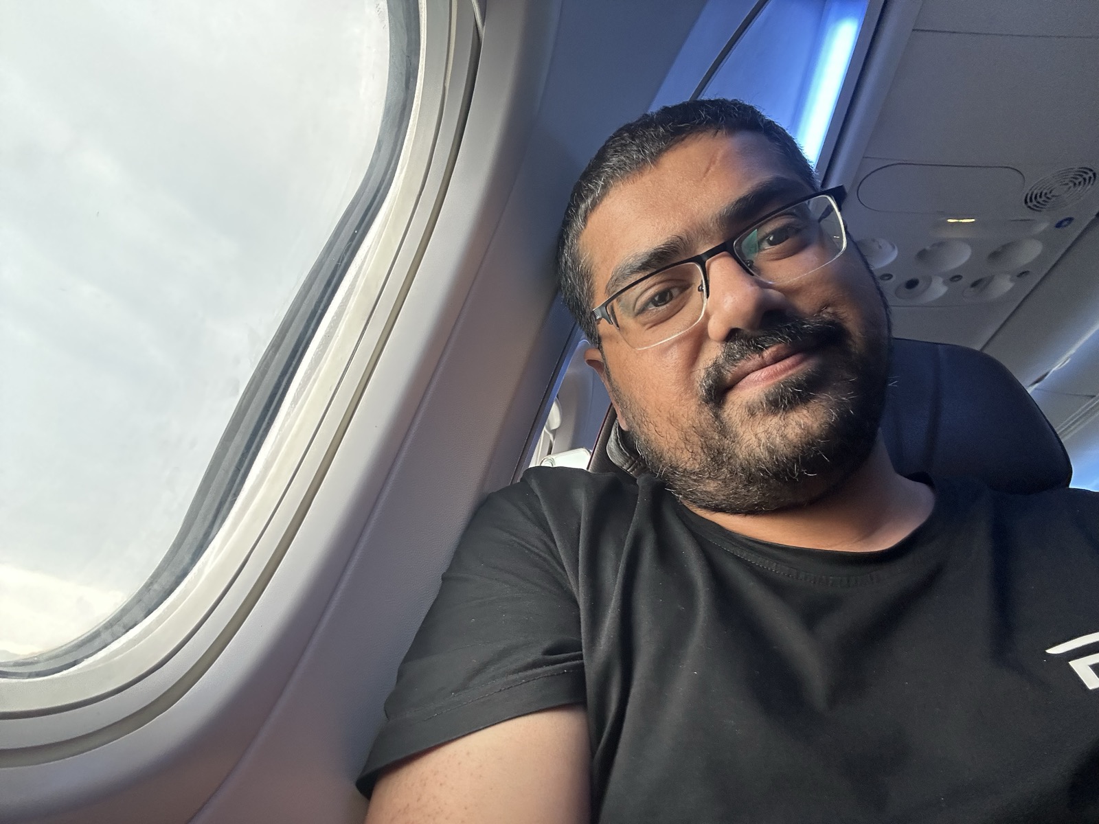 Admin final selfie — window seat, leaving Malaysia